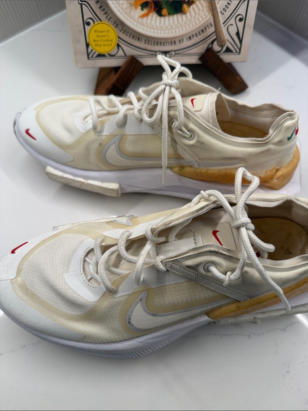 Nike Cream/White Athletic Sneakers with Red Swoosh Accents